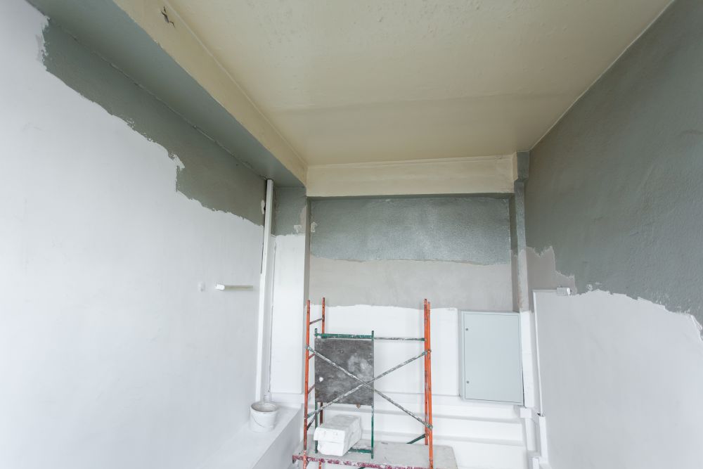 Room with ladders during under renovation, remodeling and construction.